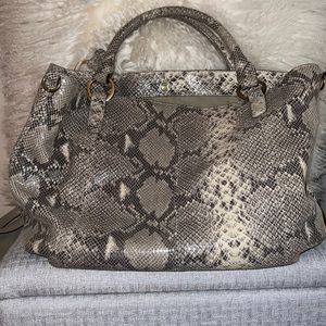 G.I.L.I. Snake print leather bag.